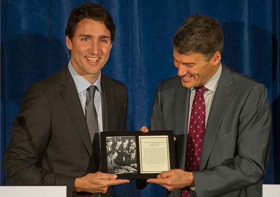 VANCOUVER, BC - DECEMBER 17, 2015, - Mayor Gregor Robertson presents Canadian Prime Minister Justin Trudeau with a photo of his visiting father as prime minister, at Vancouver City Hall in Vancouver, BC. December 17, 2015. (Arlen Redekop / PNG photo) (story by reporter) [PNG Merlin Archive]